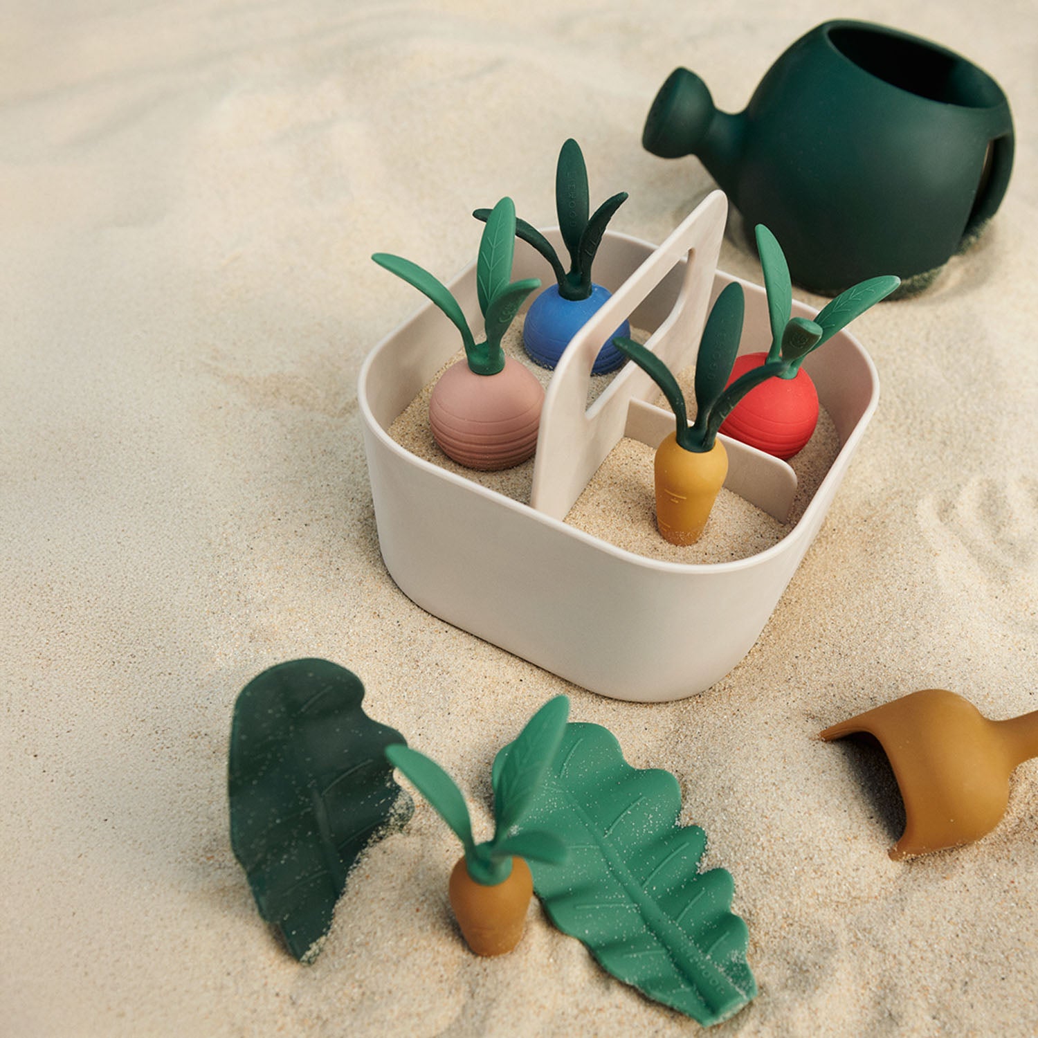 Soft sandy multi mix colors of Liewood gardening set.