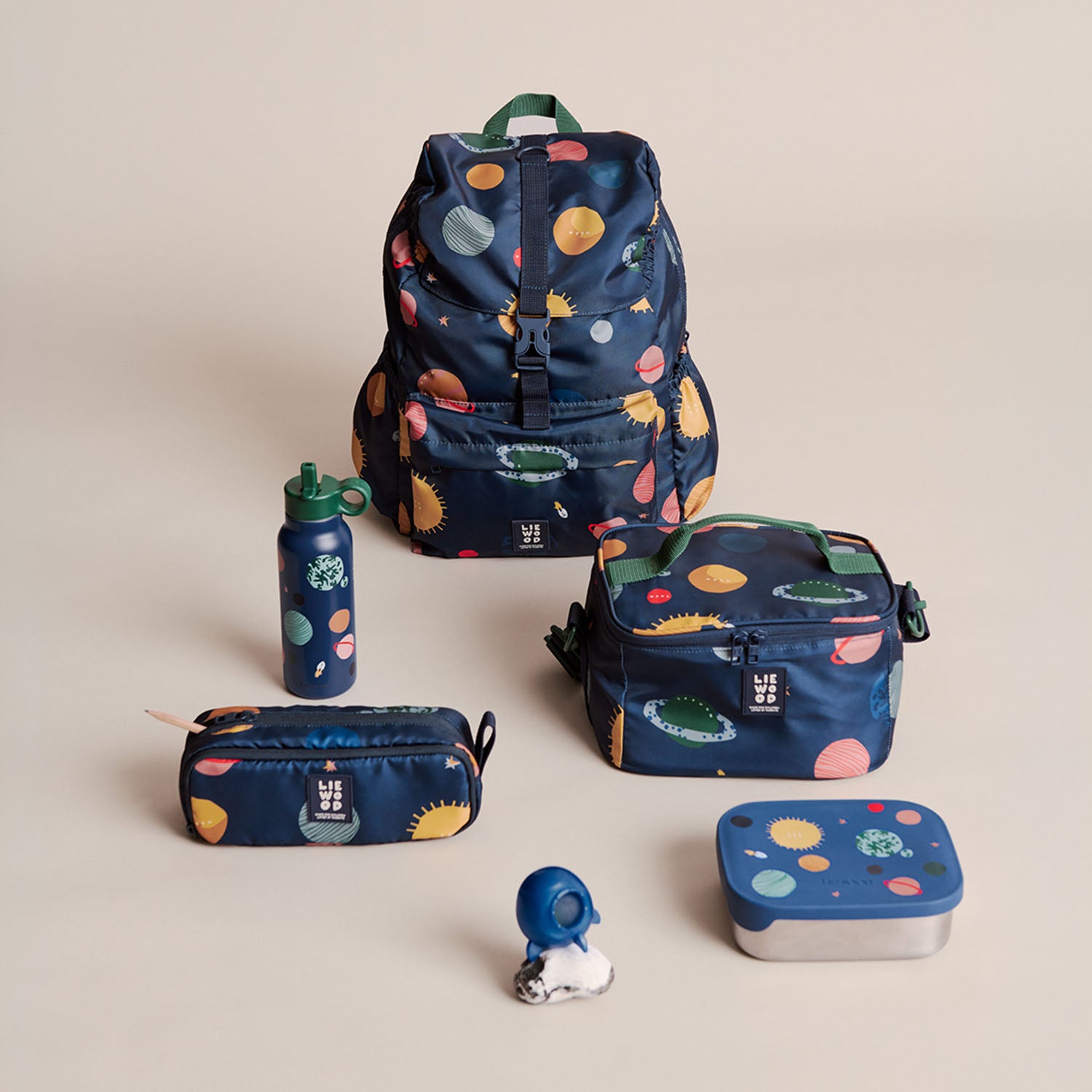 Lifestyle image of Liewood school essentials including backpack, lunch box, water bottle, and Cindy pencil case