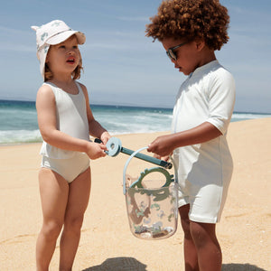 Two children are catching crabs with this fishing set for crabs.