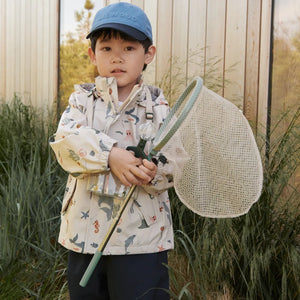 Child using the outdoor kit to explore nature