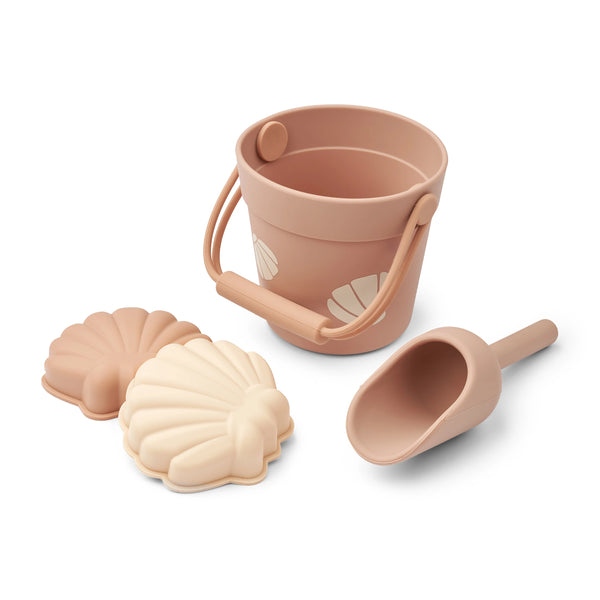 Liewood Kit Mini Seashell Beach Set in Pale Tuscany: A delightful ensemble for beach adventures, featuring a mini bucket, shovel, and two seashell moulds
