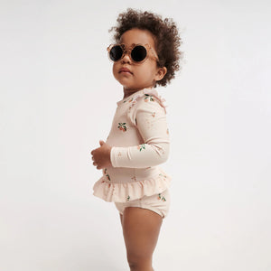 A toddler is wearing swimsuit