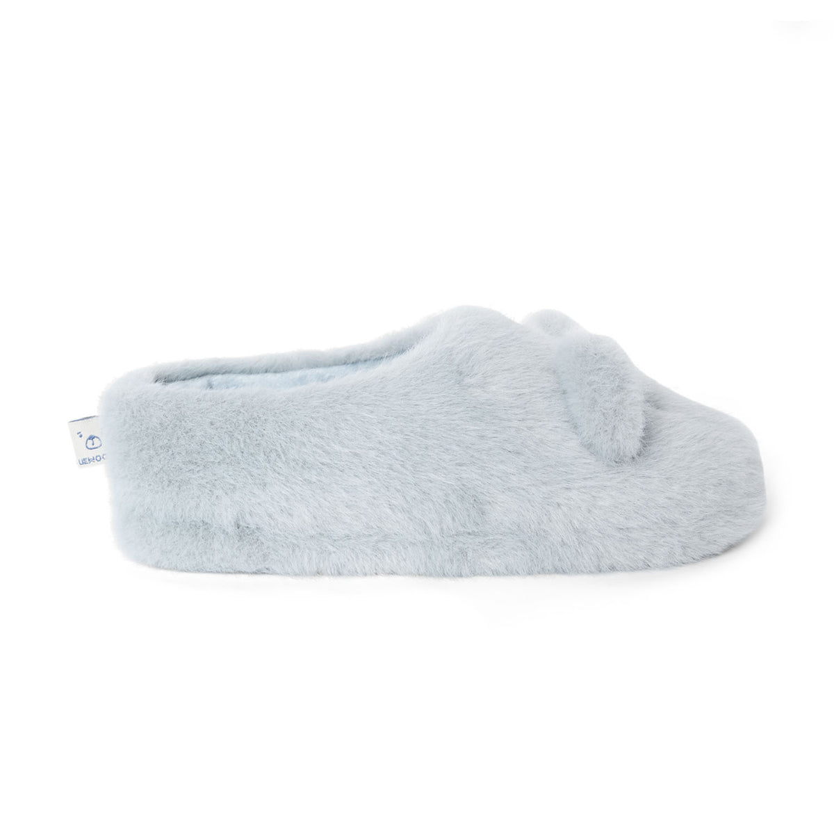 A side profile view of a single dove blue Liewood Aviaja bear slipper, highlighting its plush texture, flat sole, and closed heel design.