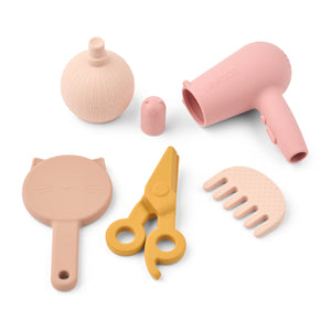 Close up of Liewood Ellery hairdressing tools: hairdryer, comb, scissors, mirror and bottle