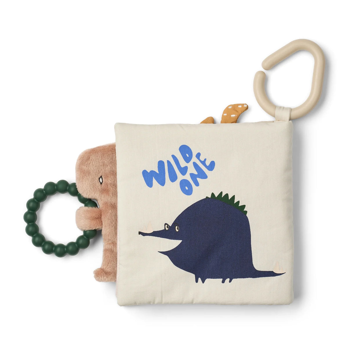 Liewood Fey fabric book showing a dark blue dinosaur with "WILD ONE" embroidered on the soft page.