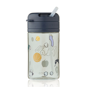 A 500ml clear tritan straw cup featuring a play dusty peppermint twist-and-lock lid, a clear silicone straw sticking out, and a transparent body covered in playful cartoon illustrations like a basketball and an apple.