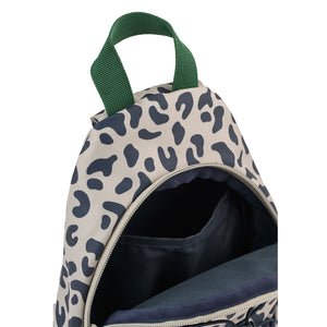 Close up view of an open Liewood leopard print crossbody bag showing the dark interior main compartment and green top handle