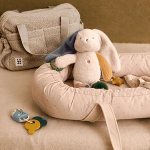 Liewood VROOM car keys resting in a soft babylift alongside a plush toy