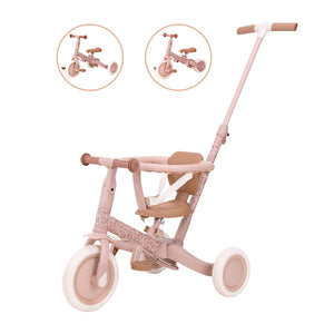 Diagram highlighting the conversion features of the pink Little Dutch 4-in-1 Tricycle, showing how it transforms from a three-wheel tricycle to a two-wheel balance bike.