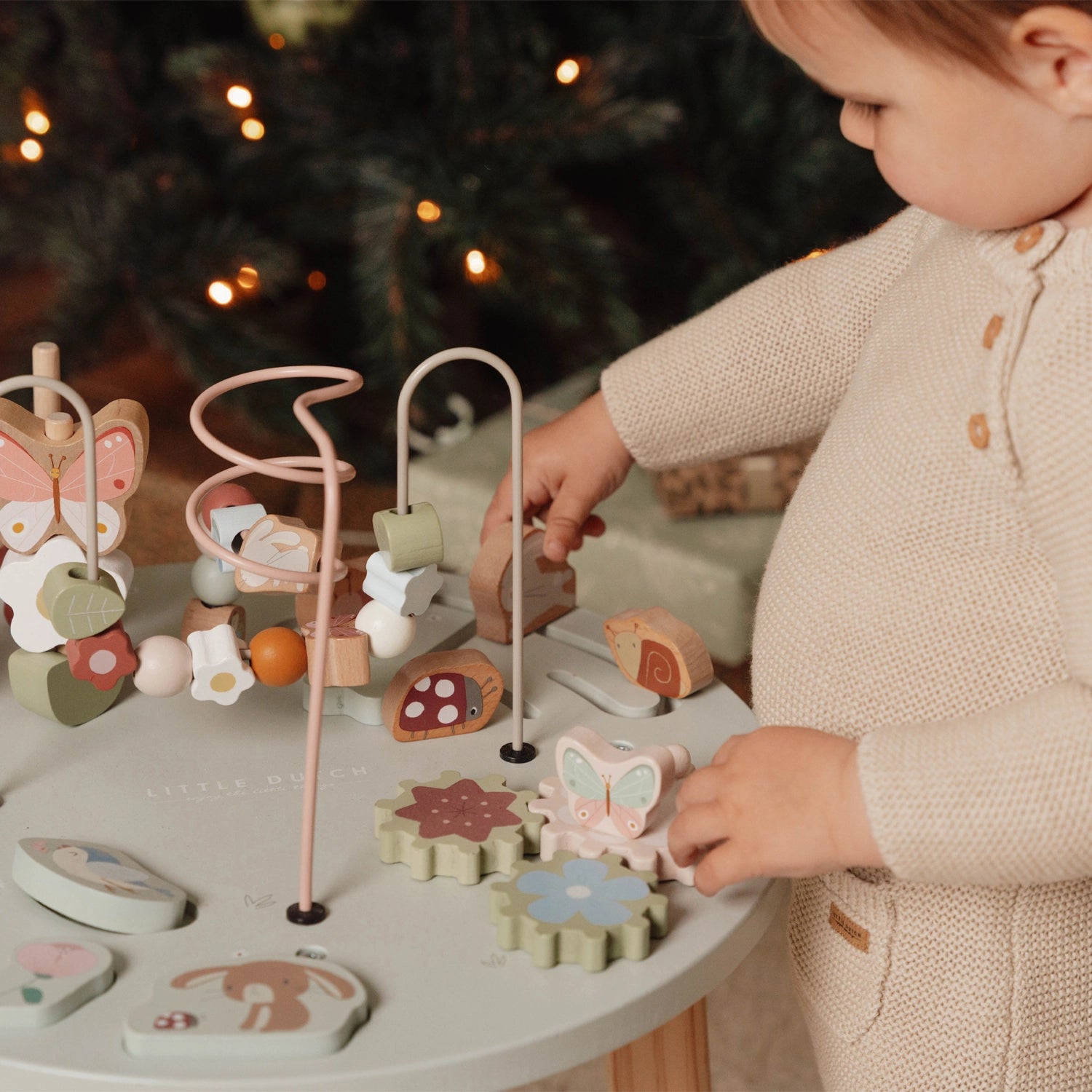 Kids playing with animal on activity table