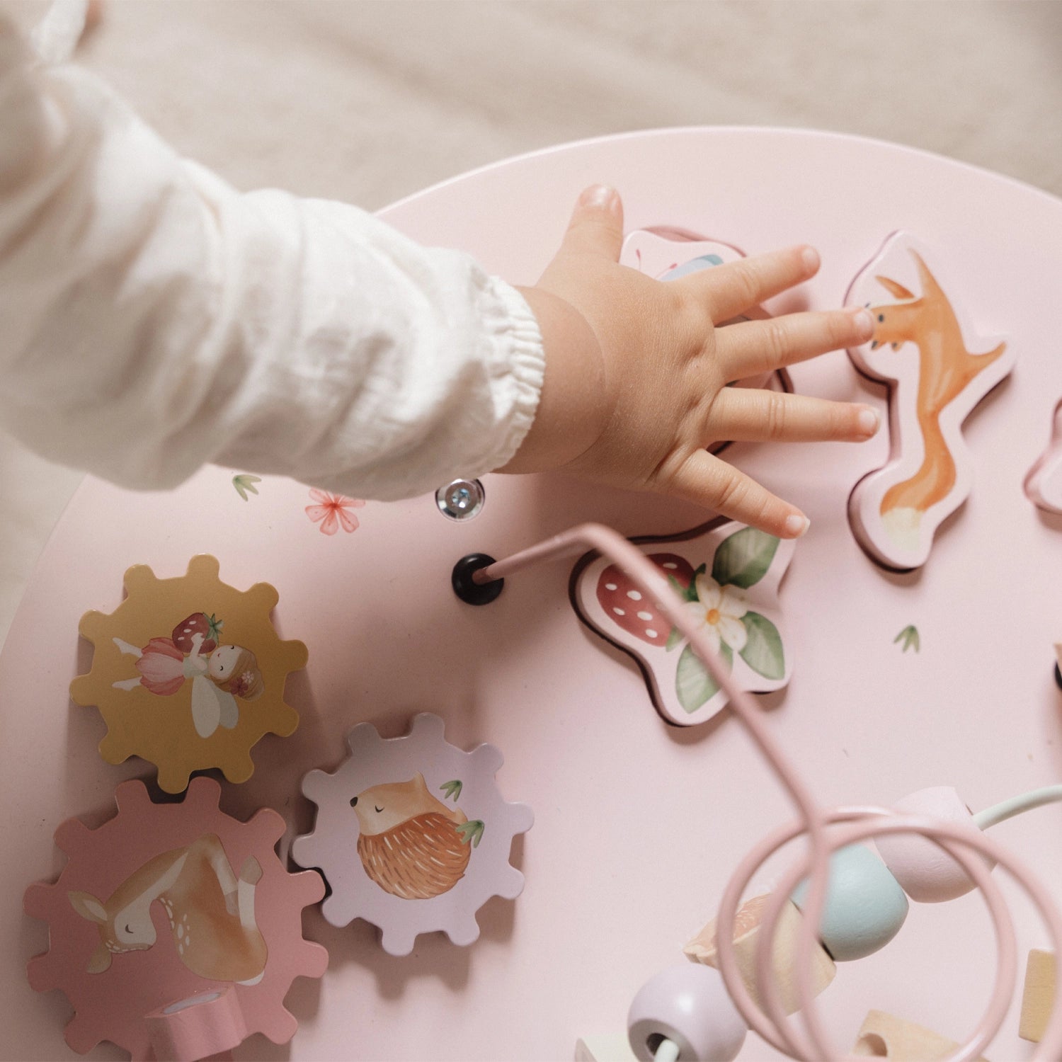 This activity table keeps toddlers busy and engaged.