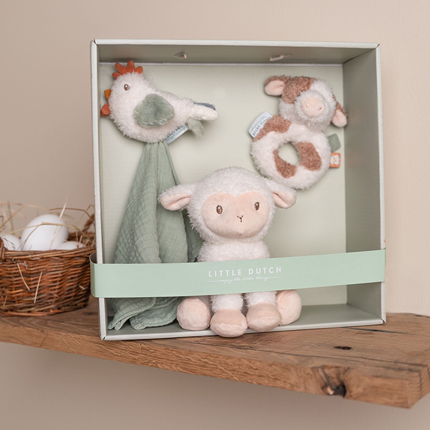 Open Little Dutch Baby Gift Set displaying the chick cloth, plush sheep, and cow rattle.