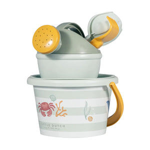 Little Dutch green beach toy set with bucket, shovel, rake, sieve, and watering can on sand.