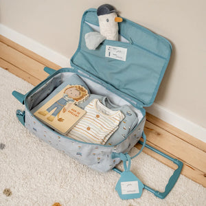 Little Dutch suitcase packed with children’s clothes, toys, and travel essentials.