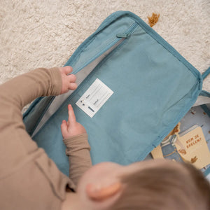 Open children's suitcase displaying spacious interior and stitched contact label.