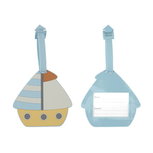 Rubber luggage tag on the suitcase for personalized contact information.