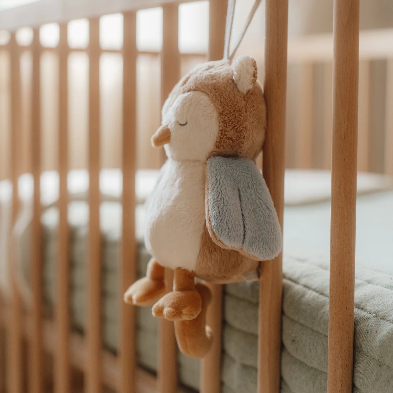 Musical owl toy for baby nursery