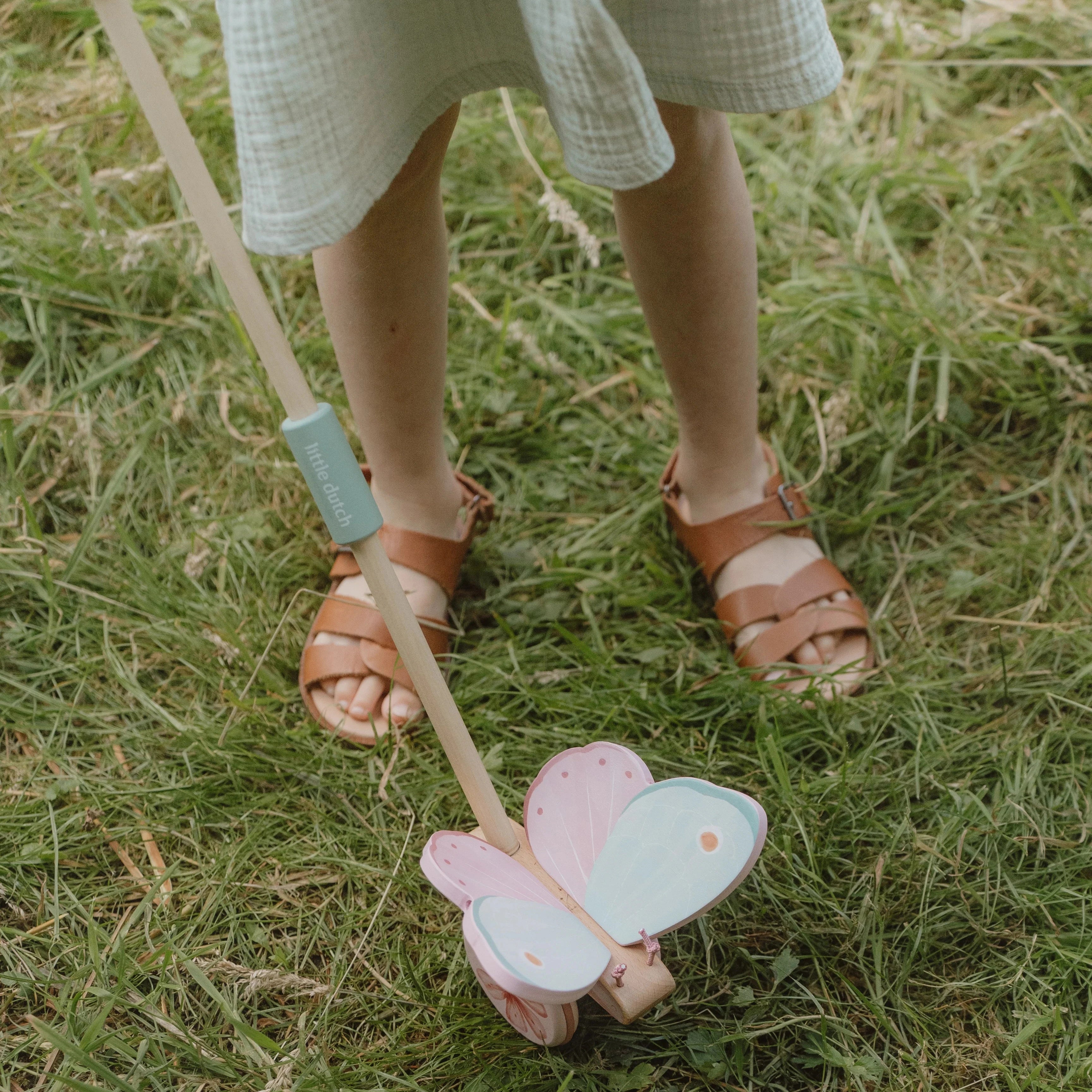 Fairy garden themed push-along rattle in pastel colors.