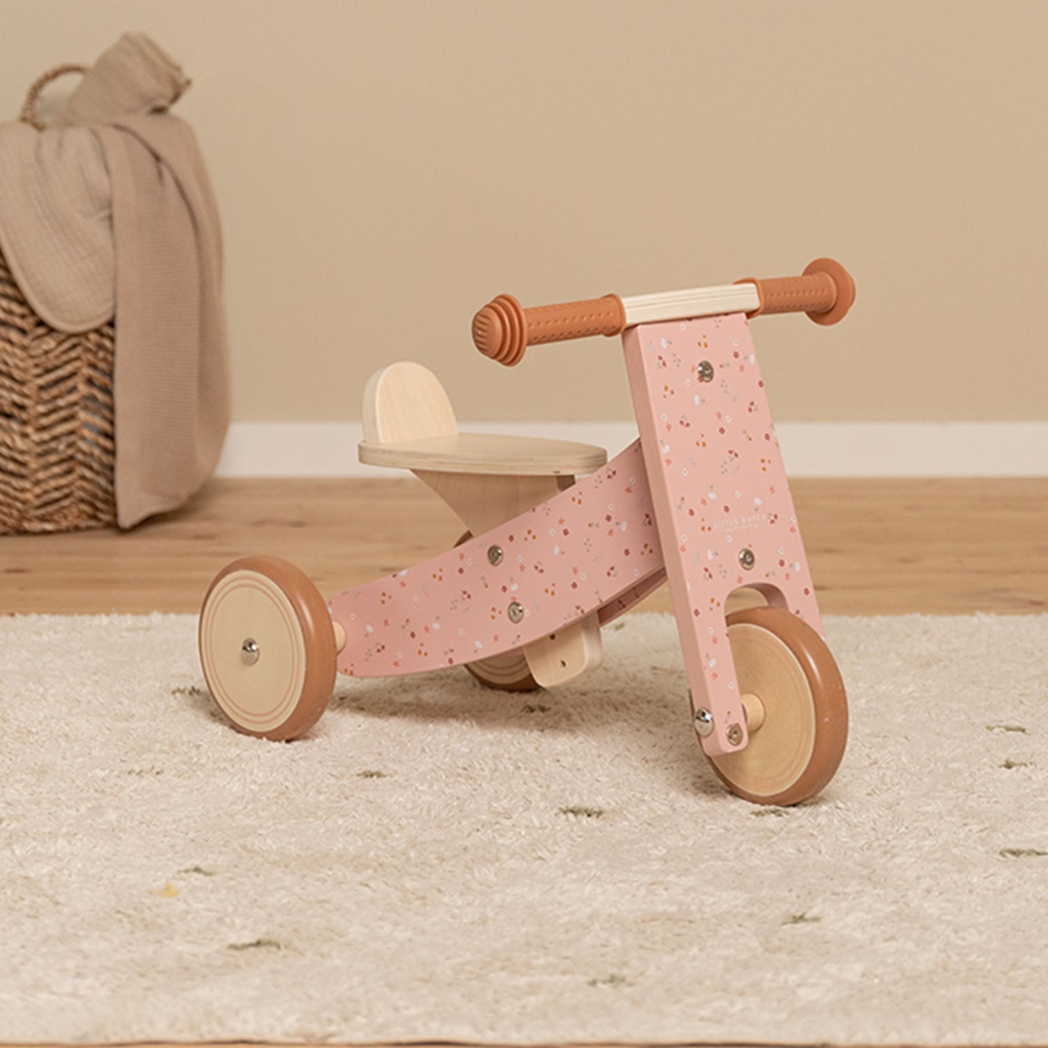 First ride-on tricycle supporting balance and coordination.