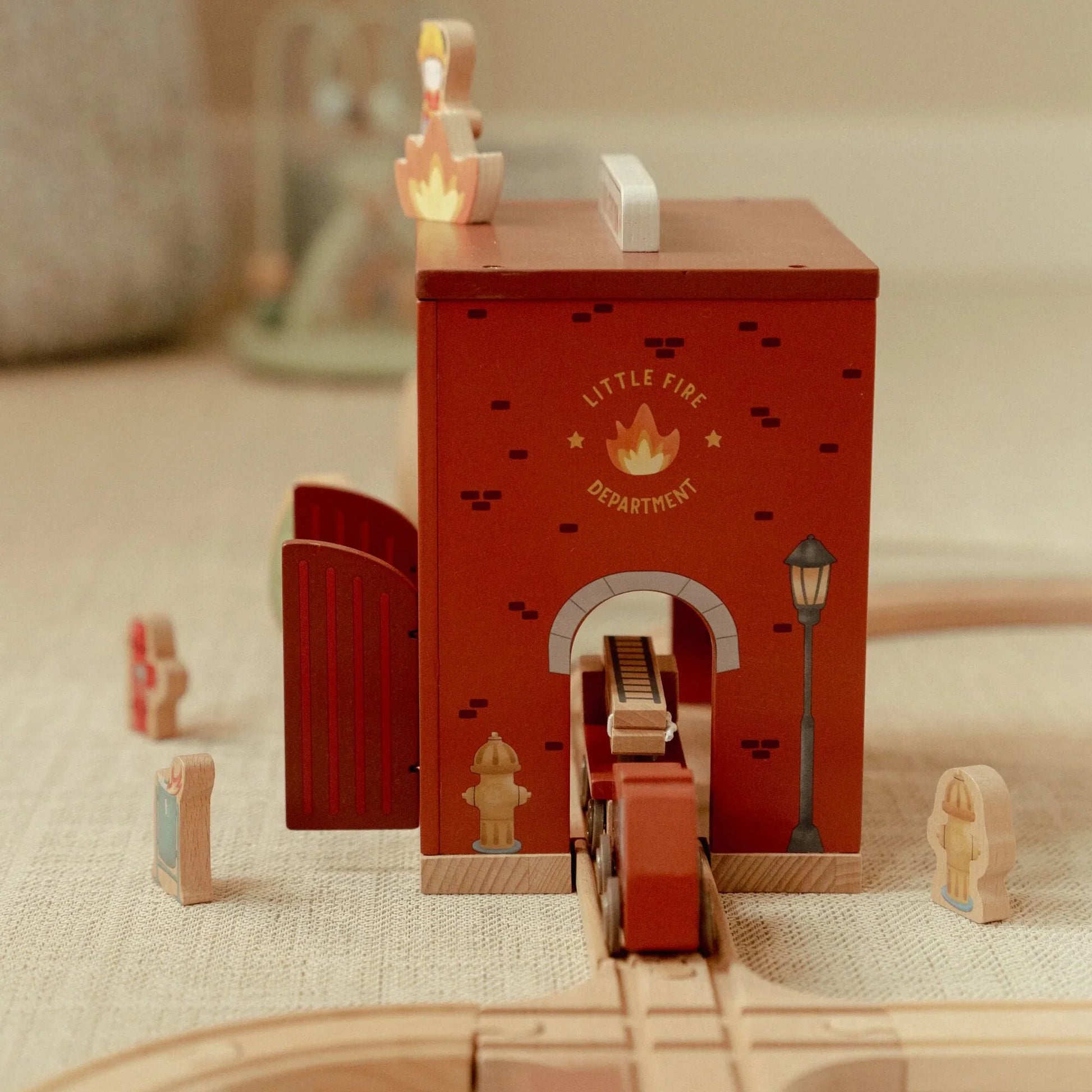 Little Dutch fire station combined with wooden train track set