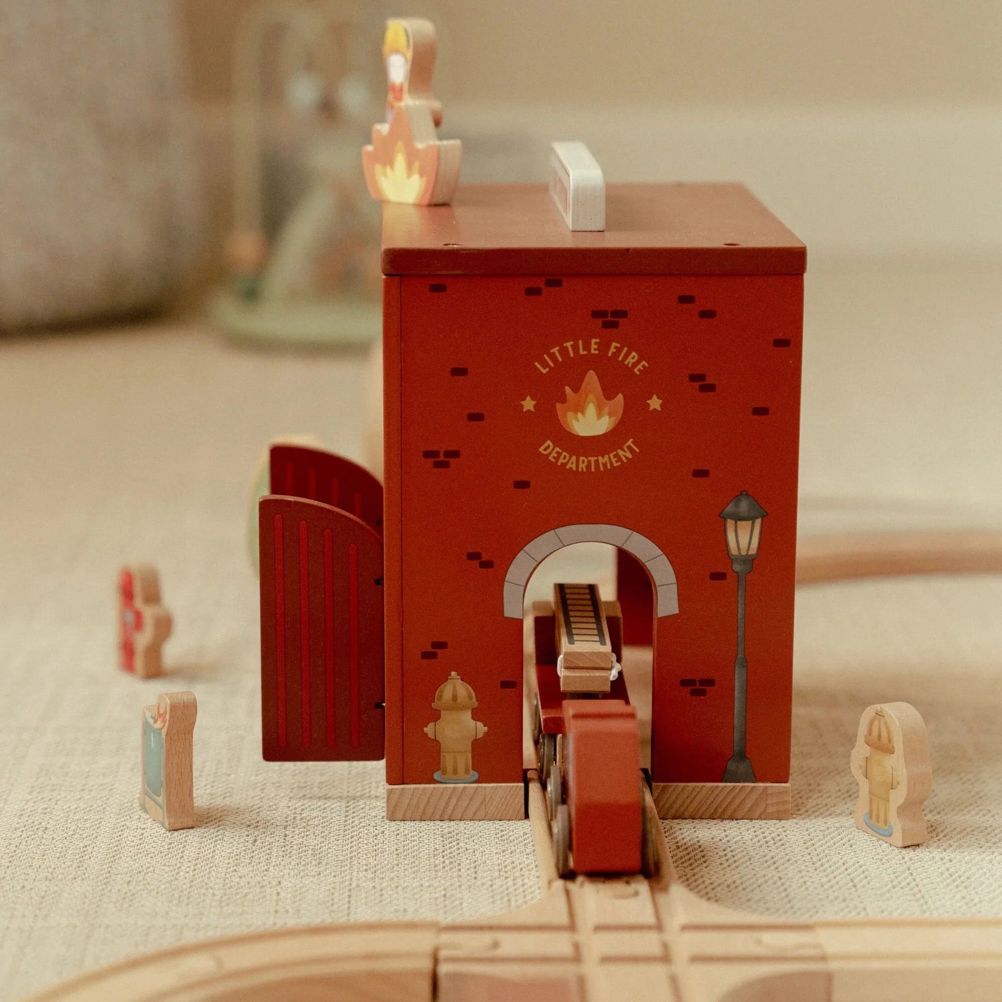 Little Dutch fire station combined with wooden train track set