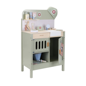 Side view of the green wooden veterinary playset with accessories.