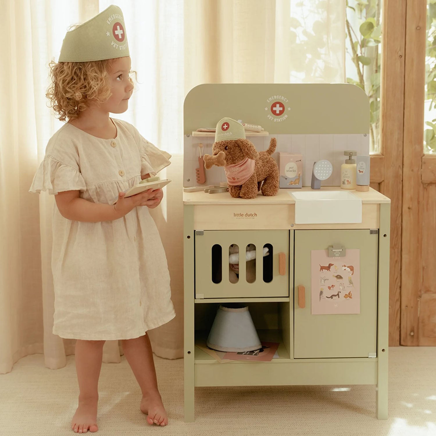 Green wooden vet clinic setup for imaginative pet care.