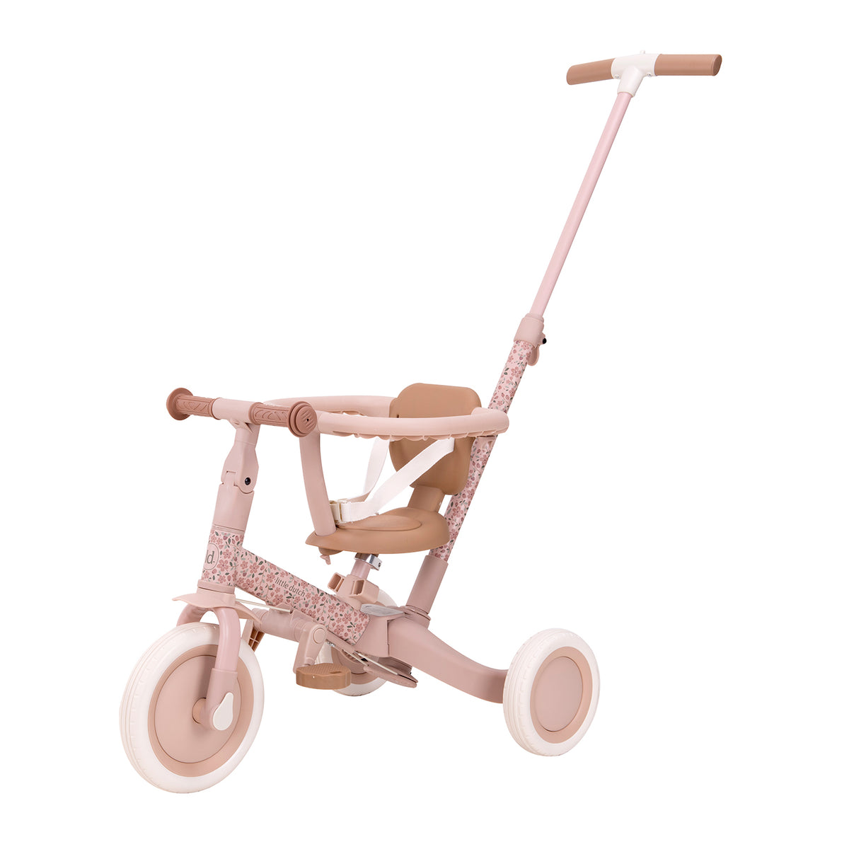 Side profile of the Little Dutch 4-in-1 Tricycle in soft pink, configured as a push tricycle featuring an adjustable parent steering bar, safety ring, and secure harness.