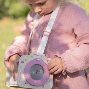 Little Dutch insect explorer toy in a garden setting.