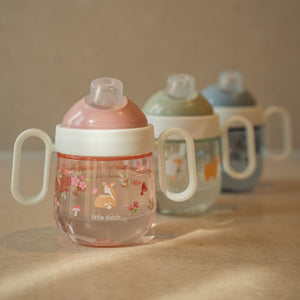 Three Little Dutch antileak spout cups displayed together, highlighting the pink Fairy Garden design alongside other available colors and patterns.
