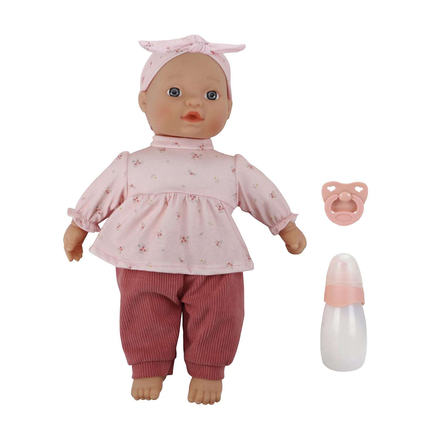 Little Dutch Baby Lily doll sitting on a white background, displayed alongside its included pink pacifier and milk bottle accessories.