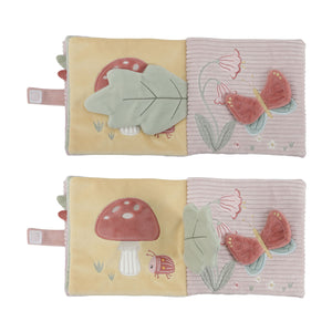 Children's soft book with nature-themed illustrations on a white background