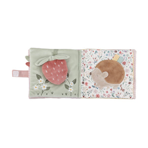 Children's soft book with a strawberry and hedgehog illustration on a white background