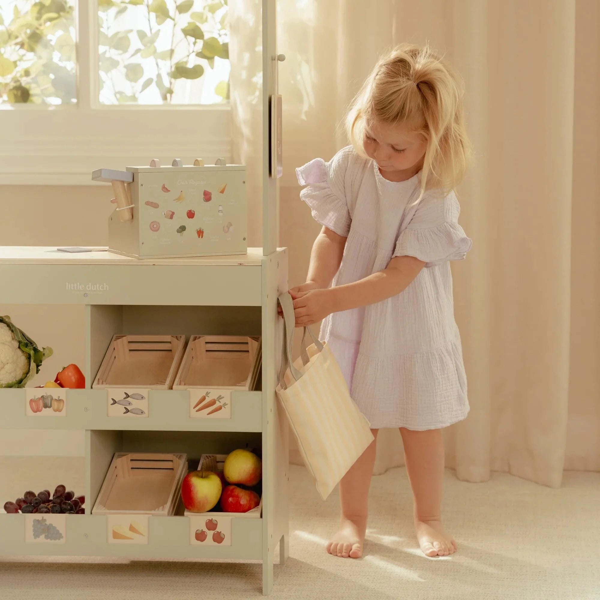 Kids playing café and shop with Little Dutch market stall.