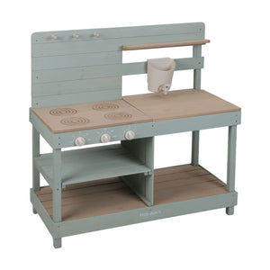 Little Dutch wooden mud kitchen in olive green with a stove top, knobs, storage shelves, and a water reservoir tap on a white background