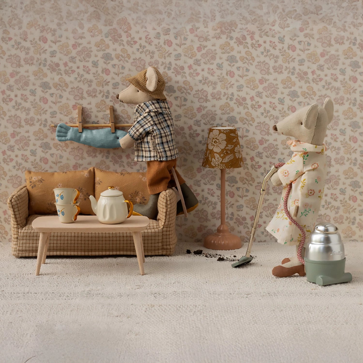 Close-up of miniature mouse couch and table