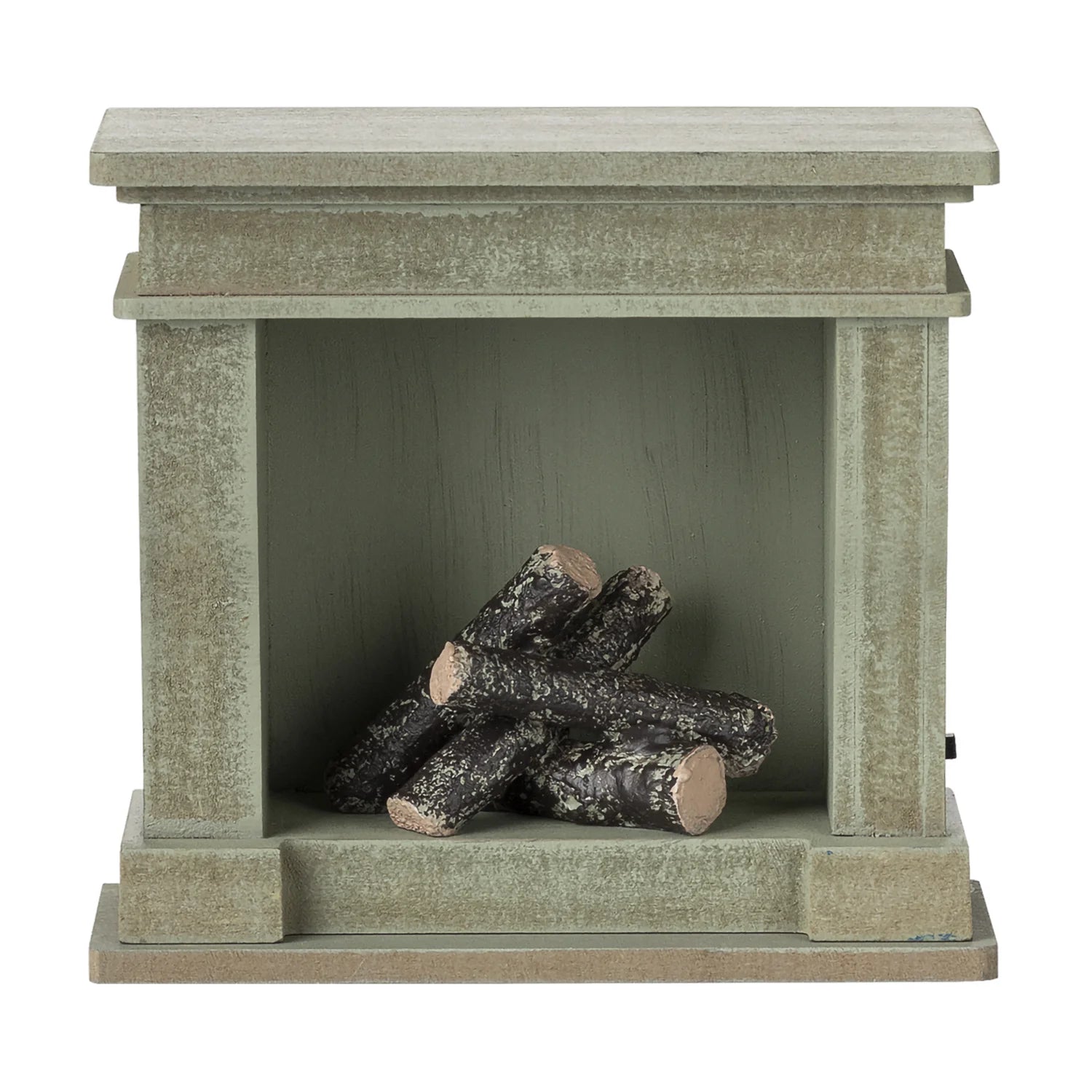 Vintage green miniature fireplace for play scenes.