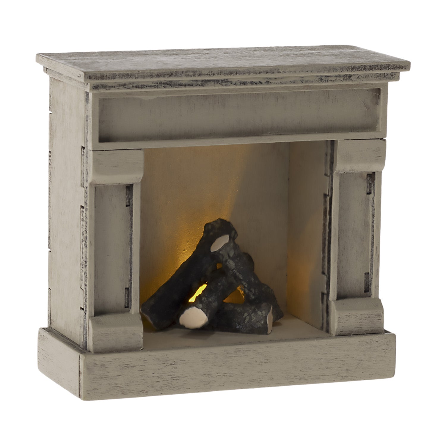 The Maileg fireplace can be turned off and on with the coin cell battery.