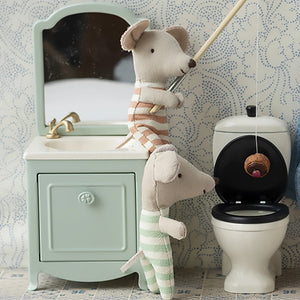 Mint green maileg sink dresser with storage.