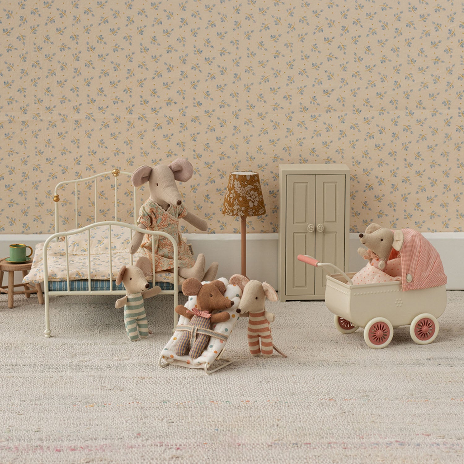 Small Maileg metal pram for baby mouse dolls.