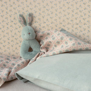Soft baby rattle with gentle sound.