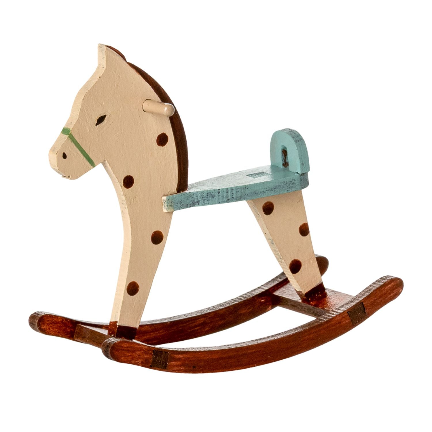 Close-up of spotted pattern on Maileg rocking horse.