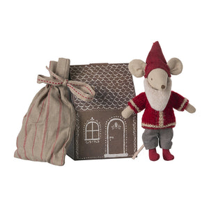 A maileg stuffed toy mouse dressed as Santa Claus with a small house and a sack of gifts, intended for children's play.