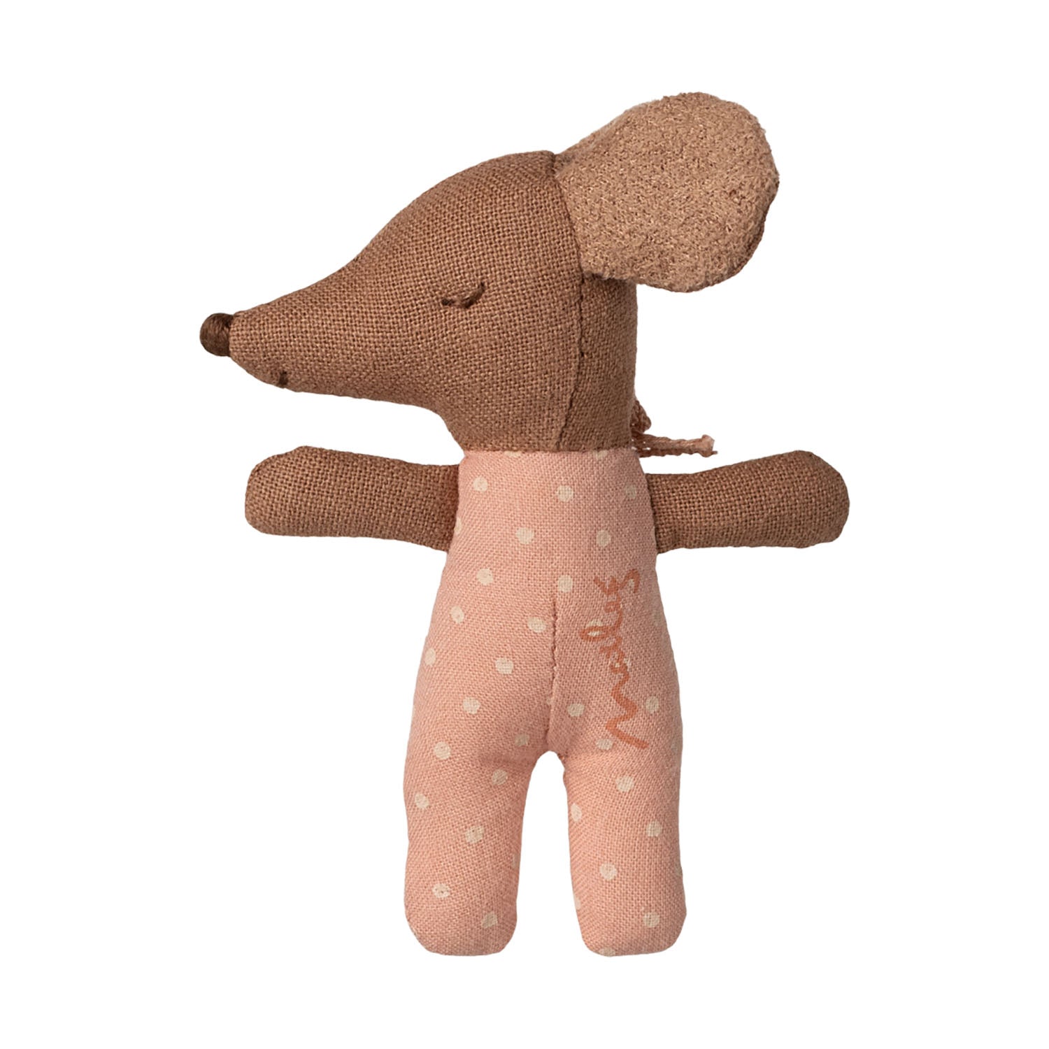 Soft fabric baby mouse toy wearing a rose-colored outfit lying on patterned bedlinen.