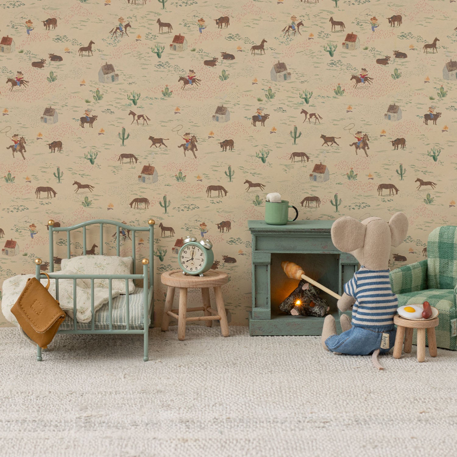 Vintage mouse bed set up with mattress, pillow, and blanket.