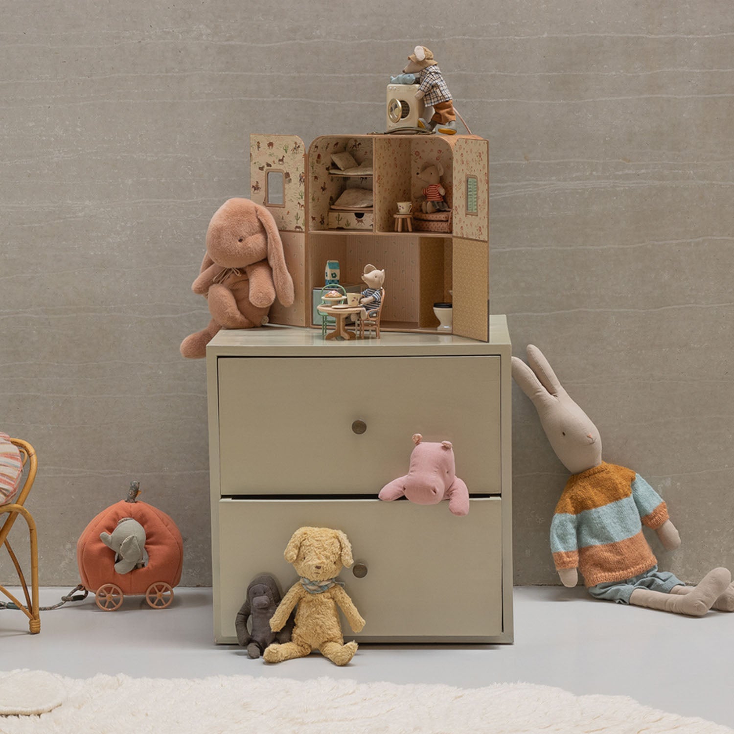 Maileg SuitCasa styled with tiny wooden furniture and mouse dolls.