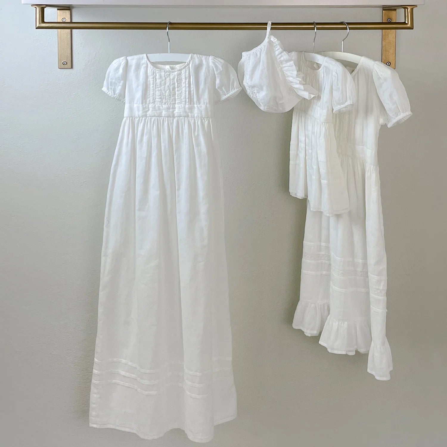 Soft Cloud-colored christening dress with timeless design and fine craftsmanship.