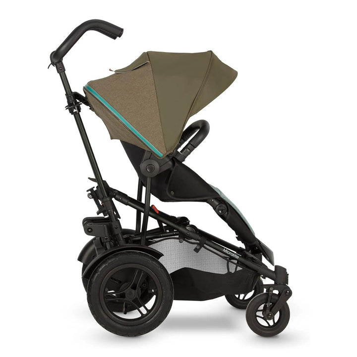 A Micralite TwoFold Evergreen stroller folded up, showcasing its compact design and green fabric with black accents.