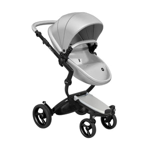 Mima Xari stroller featuring a black chassis and argent pod, angled front view.