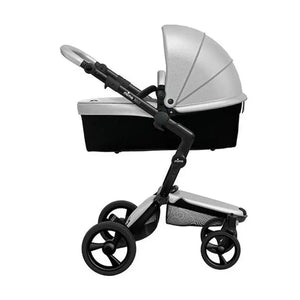 Mima Xari stroller in carrycot mode side profile with black chassis and argent canopy.